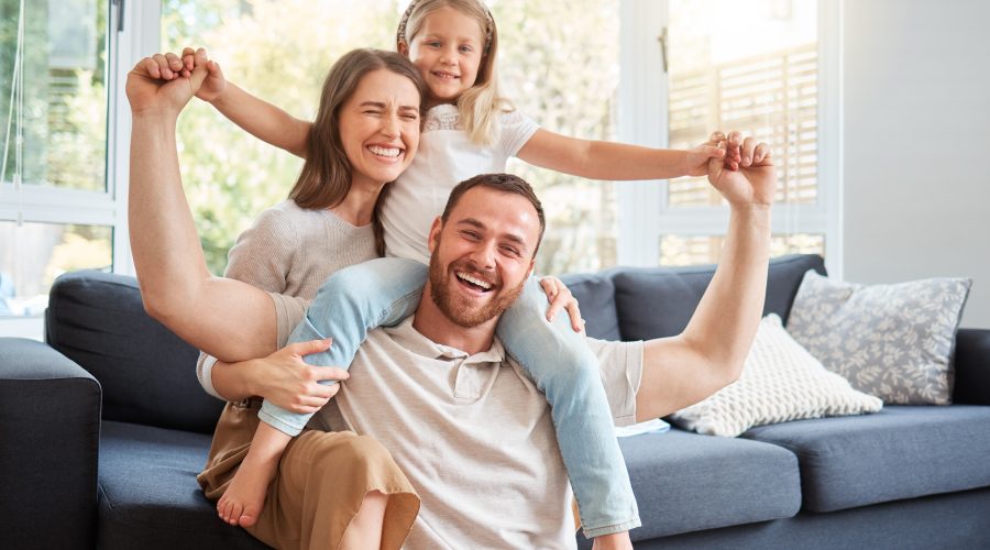 Smiling family at home enjoying fresh clean indoor air in Annapolis