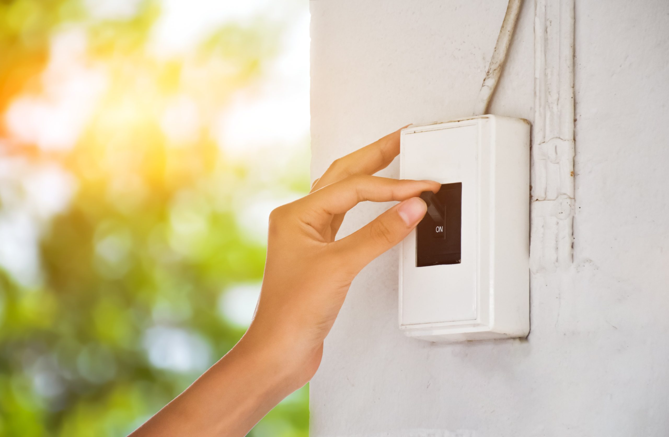 Homeowner checking circuit breaker panel for safe reliable electricity