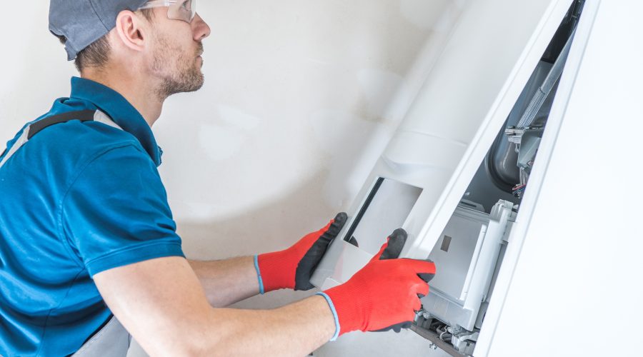 HVAC technician performing furnace repair on a home heating unit in Silver Spring