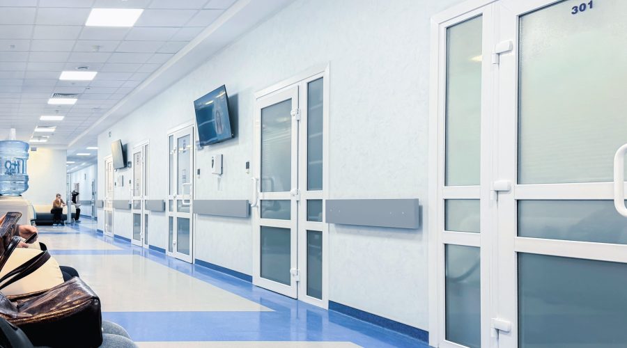Hospital corridor in Lutherville with clean, controlled environment and closed patient room doors, representing stable airflow conditions in a healthcare facility