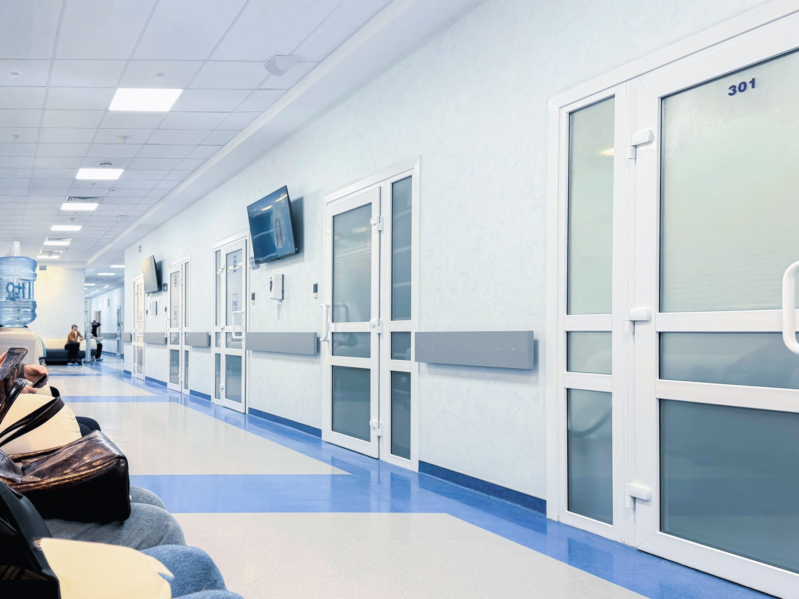 Hospital corridor in Lutherville with clean, controlled environment and closed patient room doors, representing stable airflow conditions in a healthcare facility