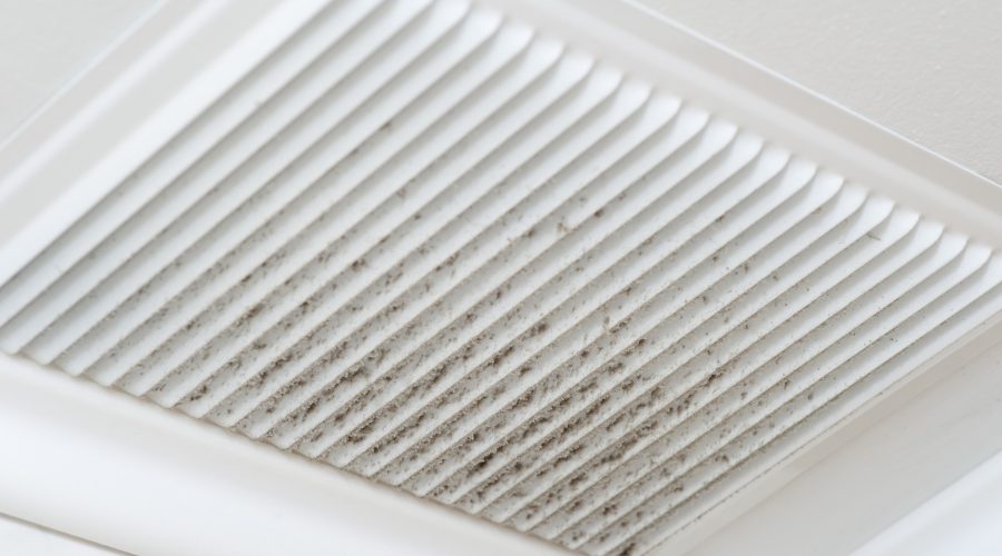 Dust buildup on ceiling air vent in a Baltimore home, showing need for indoor air quality systems and whole home air filtration.