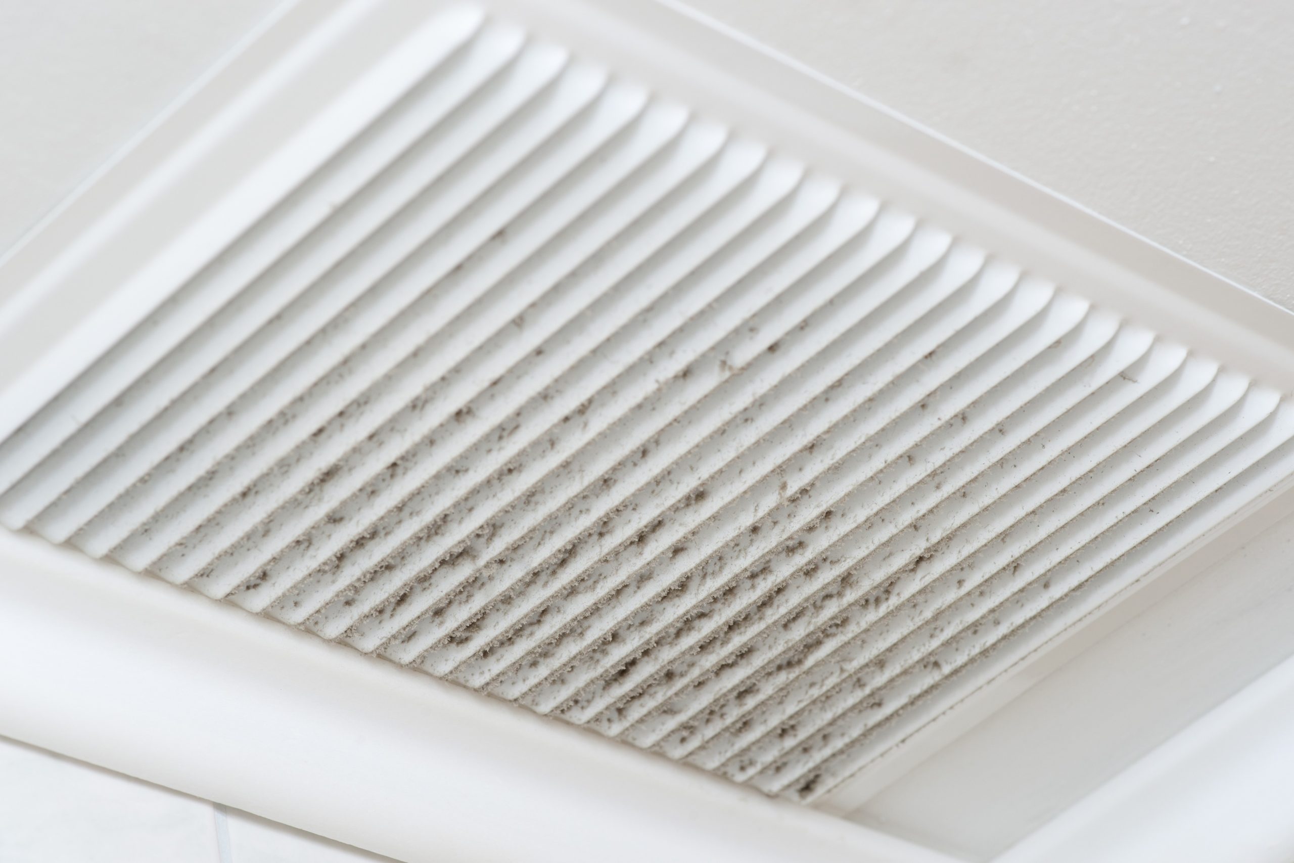 Dust buildup on ceiling air vent in a Baltimore home, showing need for indoor air quality systems and whole home air filtration.