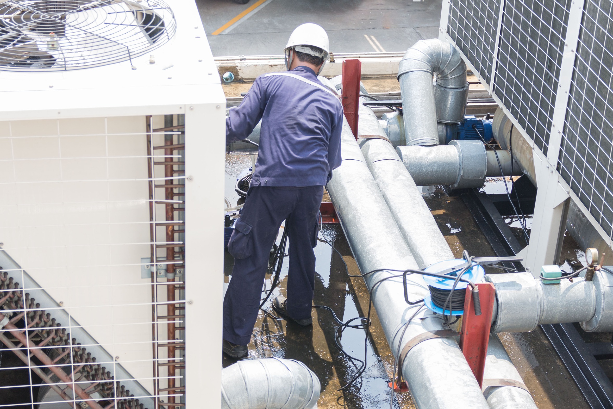 Commercial HVAC mechanical contractor servicing industrial air conditioning equipment.